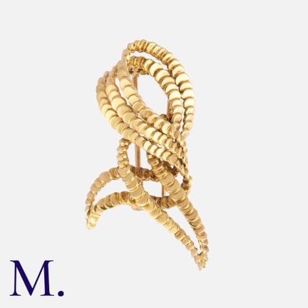 BOUCHERON, broche abstraite en or jaune 18 carats,