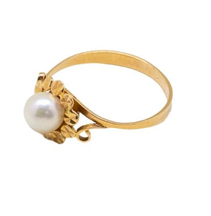 Petite bague en or jaune 18 K (750/1000) centrée d