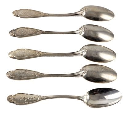 Set of 5 silver teaspoons; the blades are decorate