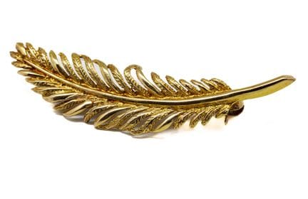 Broche plume en or jaune 18 K (750/1000) 
L. : 4,8
