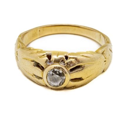 Bague en or jaune 18 K (750/1000) centrée d'un dia