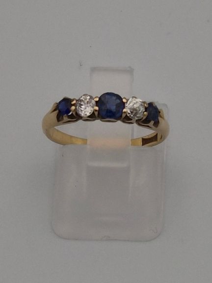 Bague en métal jaune à cinq pierres, certifiée en 