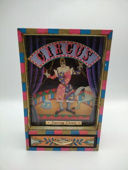 Portagioie meccanico musicale a forma di clown da 