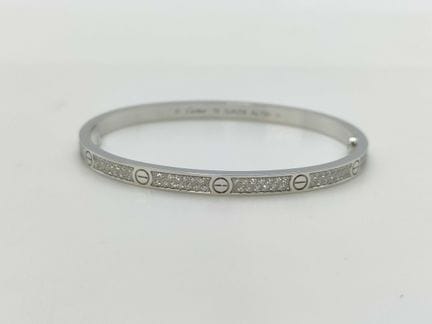 Bracciale rigido Cartier Love con pavé di diamanti
