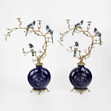 CANDELABRI, COPPIA
a forma di uccelli tra gli albe