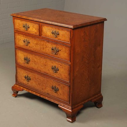 A GEORGE III STYLE BURR WALNUT VENEERED CHEST OF D