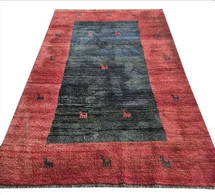 GABBEH RUG 
abrashed blue field and red border, 29