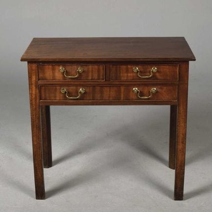 GEORGE III MAHOGANY LOWBOY 
with three frieze draw