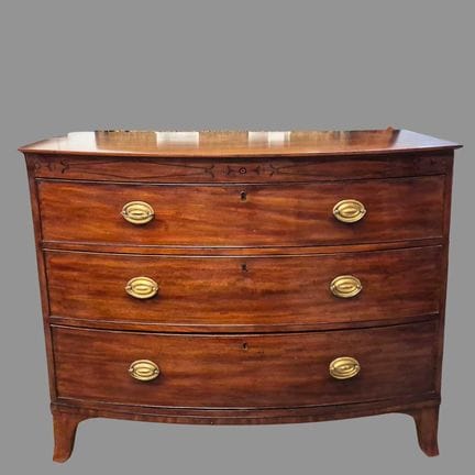 REGENCY MAHOGANY BOWFRONT CHEST 
three drawers, 94