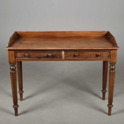 SECOND QUARTER 19TH CENTURY MAHOGANY WRITING TABLE