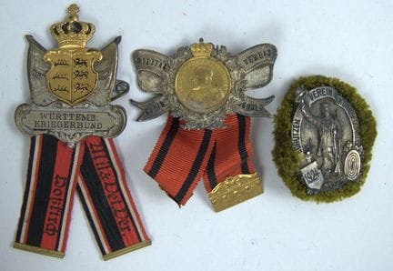 Two Königseggwald badges and one Kriegerbund badge