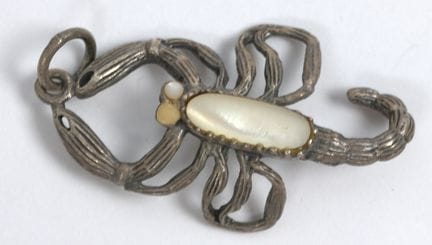 Scorpion pendant with a shimmering mother-of-pearl