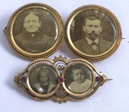 Two Art Nouveau double photo brooches.