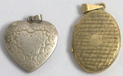Two 835 silver pendants, including a medallion.
