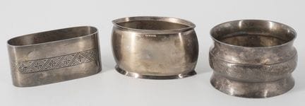 Three napkin rings, hallmarked silver. Various des