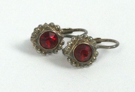 835 sterling silver earrings with a red gemstone.