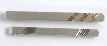 Due spille da cravatta in argento 925.