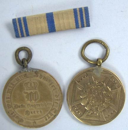 Two war commemorative coins honoring soldiers from