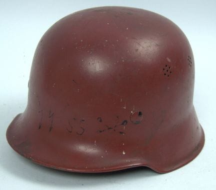 Red steel helmet, likely an M34 model used by the 