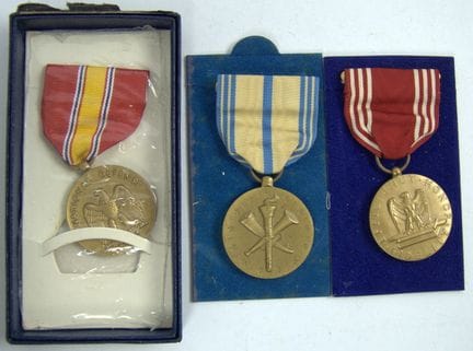 Three U.S. Army medals, along with a presentation 