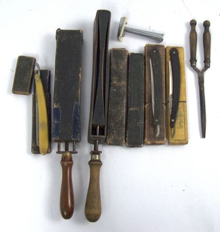 A large lot of older barber supplies, including se