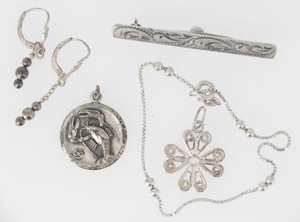A small lot of silver jewelry from a liquidation s