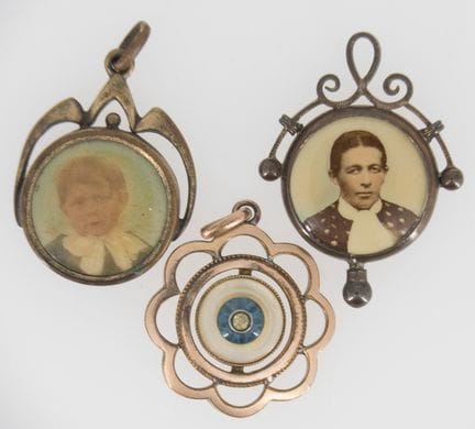 Three Art Nouveau pendants.