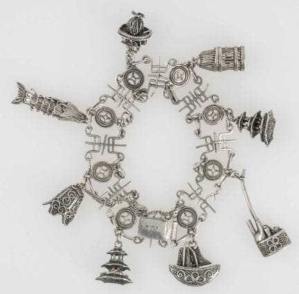 Bracelet, silver, with many charms. Length: approx
