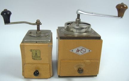 Two antique wooden hand-crank coffee grinders, dif
