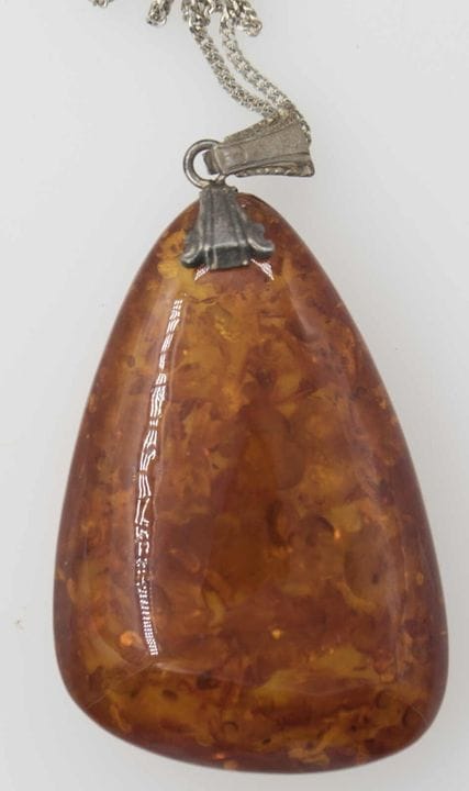 Necklace with an amber pendant, 835 silver. Length