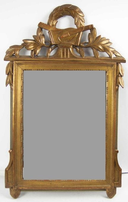 Antique wall mirror in the Louis XVI style with a 