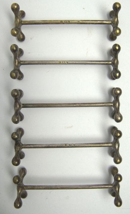 Five Art Nouveau-style "bone-shaped" knife stands,