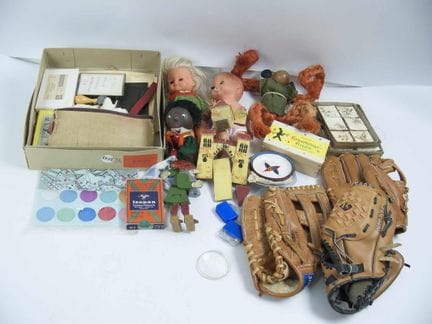 Assorted toys, including three baseball gloves, do