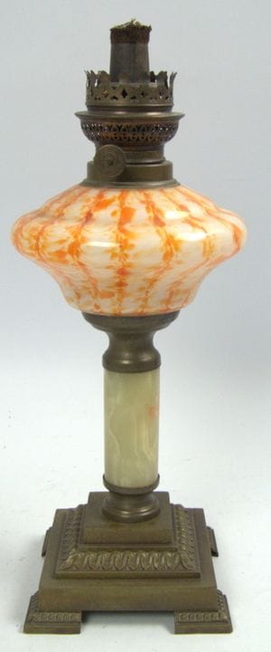 Antique kerosene lamp with a square brass base. Th