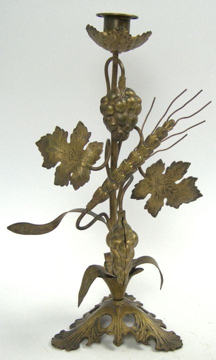 Brass altar candlestick with decorative grapes and