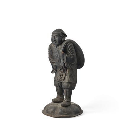 Una figura de pie de Daikokuten. Una figura de pie