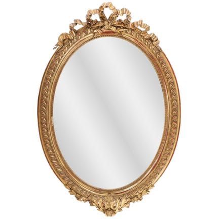 MIROIR OVALE DE STYLE LOUIS XV, EN BOIS DORÉ ET GE