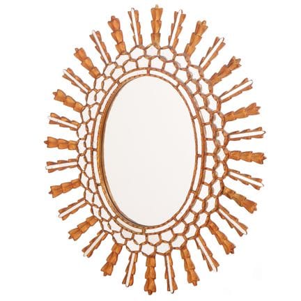 MIROIR « SUNBURST » EN BOIS SCULPTÉ ET DORÉ, VERS 