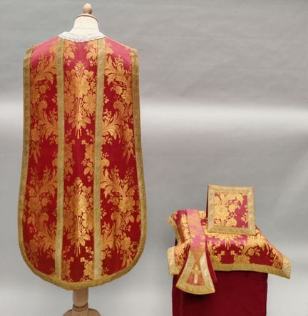 ORNAMENT made of red and gold brocaded silk fabric