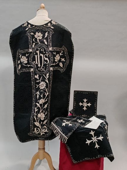 ORNAMENT made of black brocaded silk fabric; the o