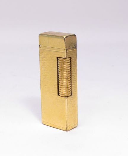 DUNHILL. Briquet de poche à molette pour dame, en 