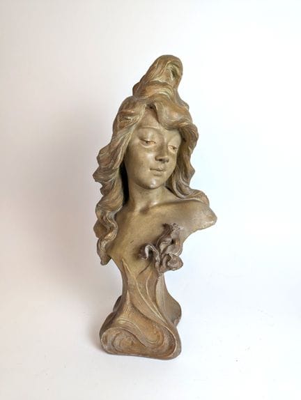Art Nouveau Bust of a Young Woman
Patinated terrac