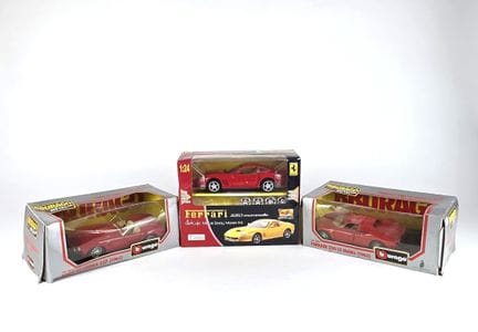 SET OF SIXTEEN CARS in a box, including: 
- 9 1/18