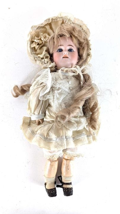 German doll with a porcelain head, open mouth, blu
