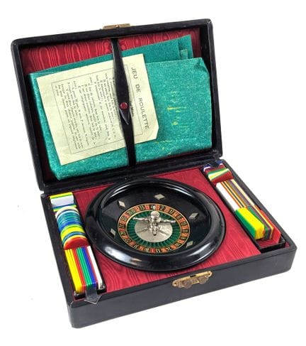 MINIATURE ROULETTE SET in a black leather case, in