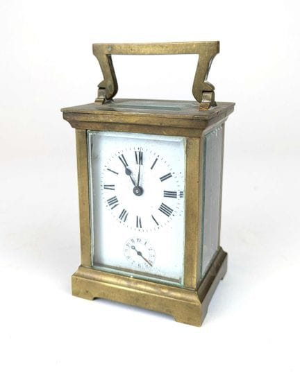 PENDULETTE dite d'officier de type cage en laiton,