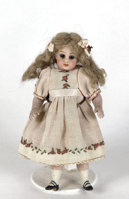 All-porcelain MIGNONNETTE, with a wig and a dress 