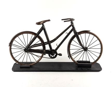 METAL BICYCLE MODEL resting on a wooden base. 
20t
