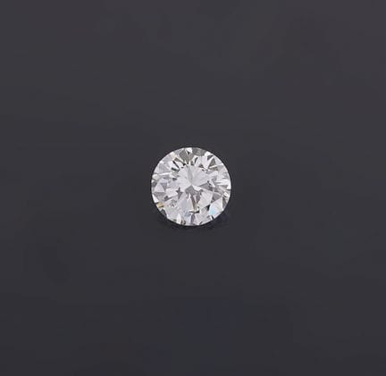 A 1.14-carat round brilliant-cut diamond accompani
