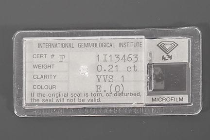 A diamond on paper (sealed) accompanied by its IGI